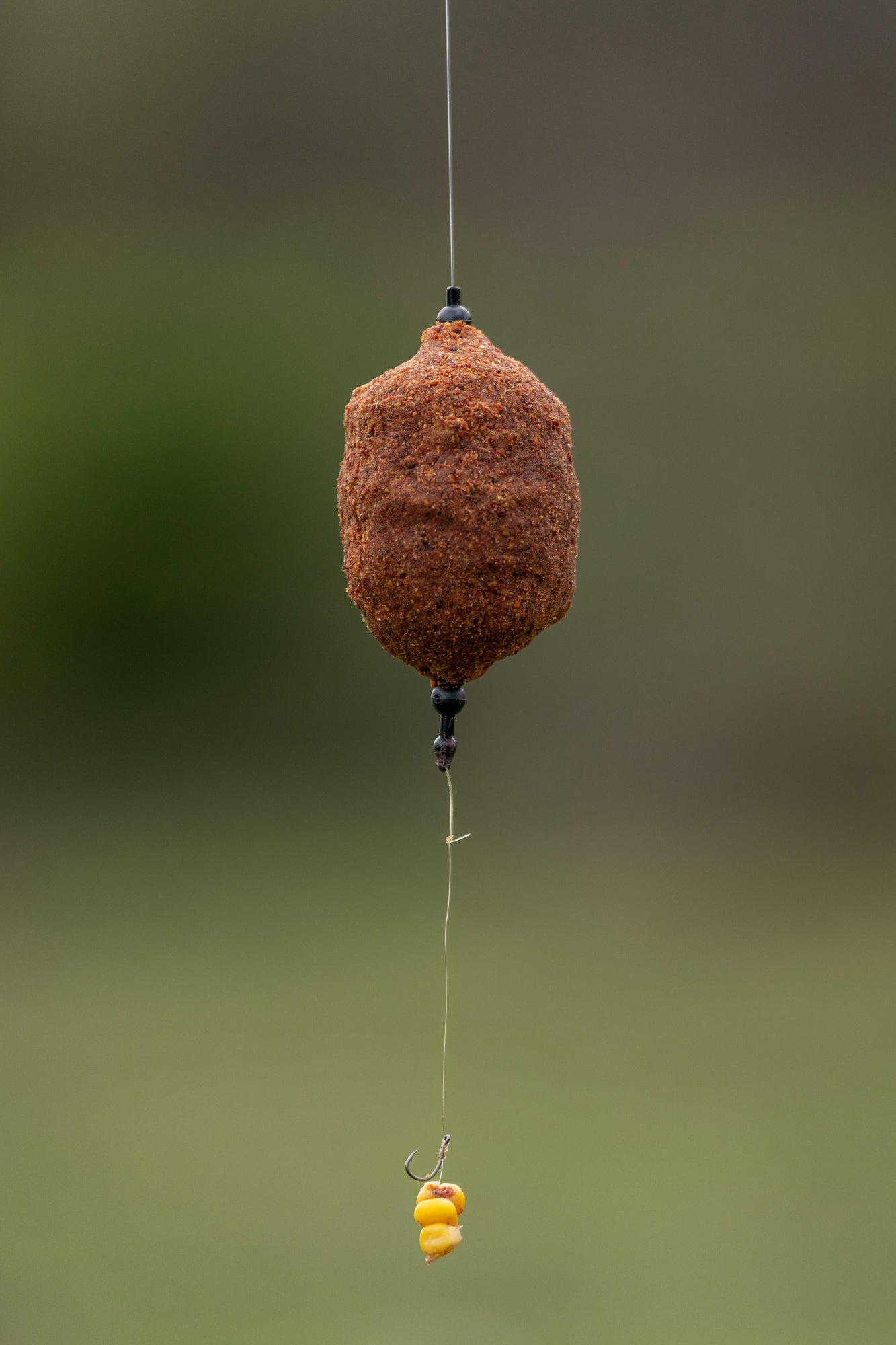 WEIGHTED COIL FEEDER