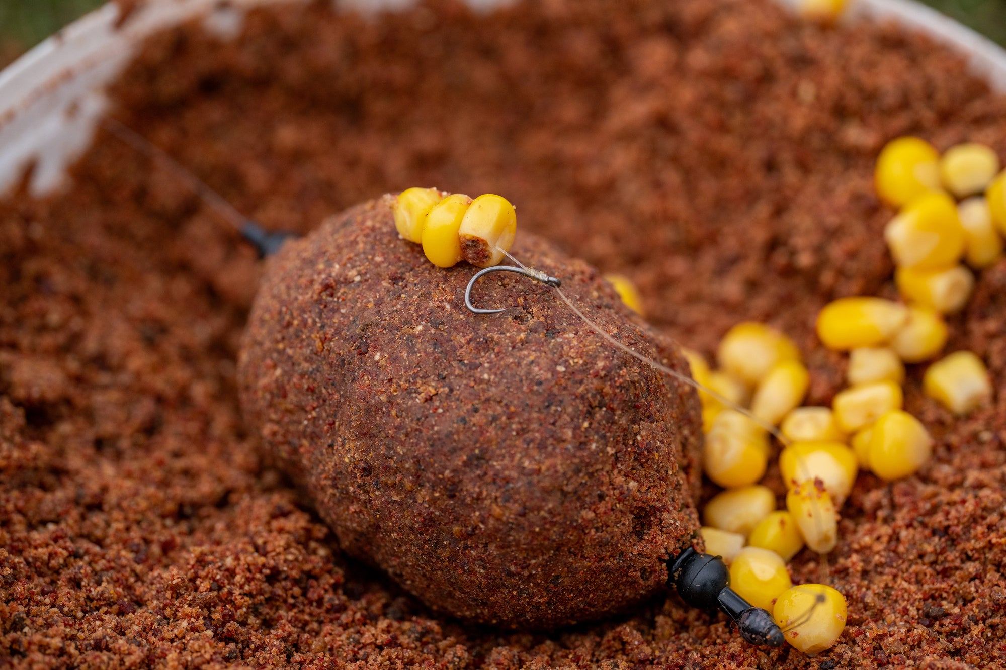 WEIGHTED COIL FEEDER