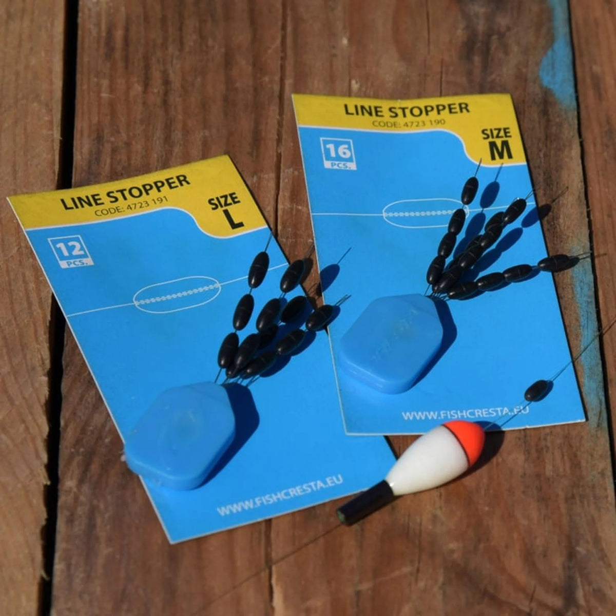Cresta Linestoppers Medium en Large naast een dobber