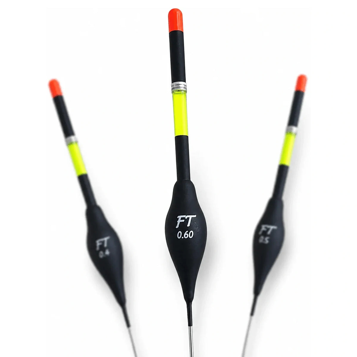 Drie zwarte Fishing Things FT1 dobbers met geel-zwarte antenne en oranje tip