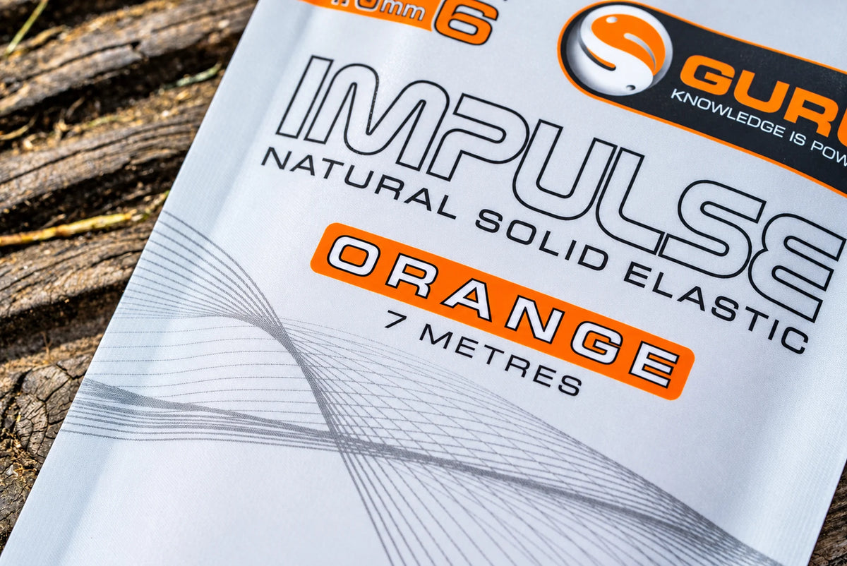 Detail van de oranje Guru Impulse Natural Solid Elastic verpakking met 7 meter aanduiding