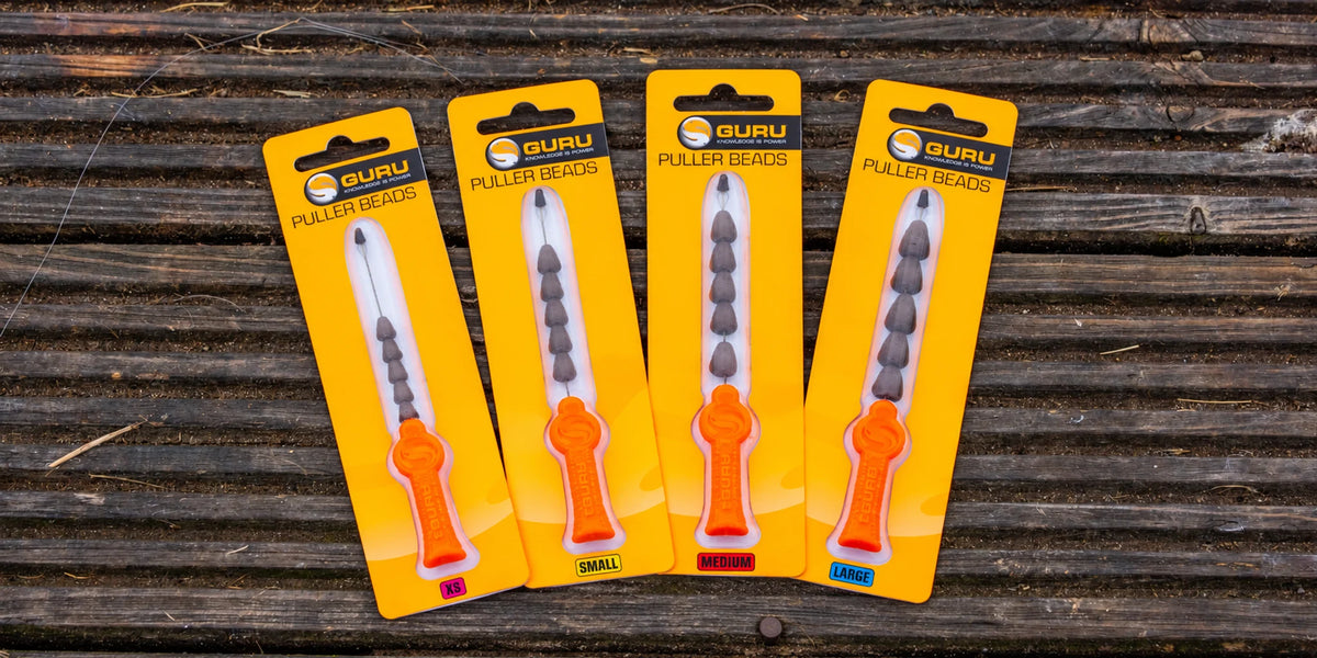 Guru Puller Beads – vier maatverpakkingen op hout
