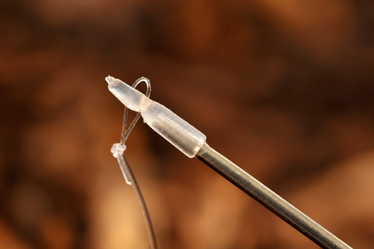 Guru Speed Needle: transparante Speed Stop op de naald met bevestigde hairlus
