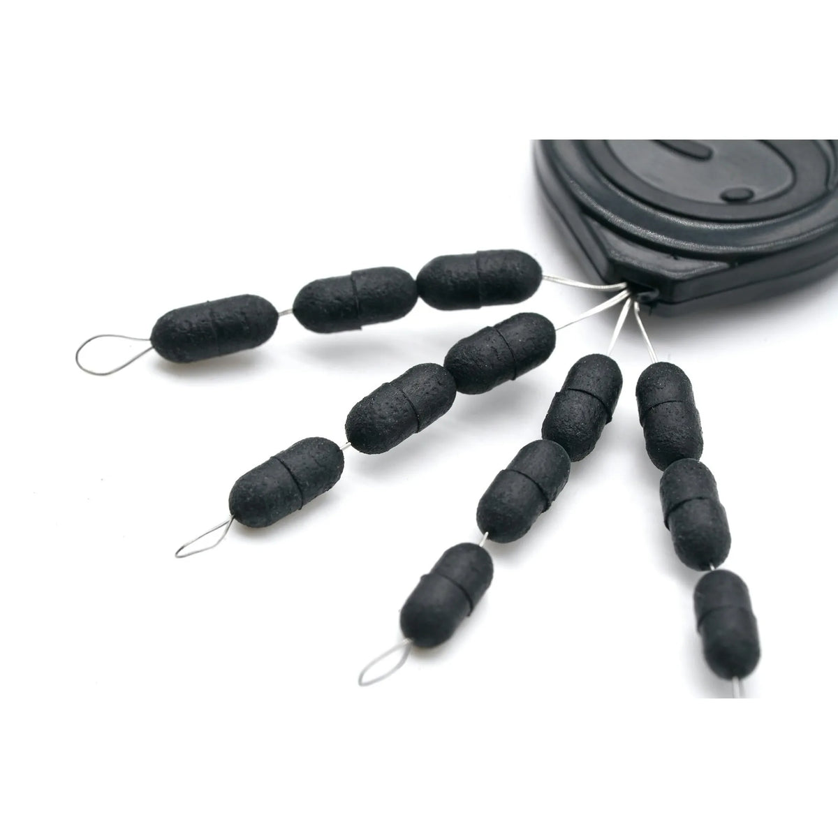 Guru Super Tight Line Stops Oval Black – close-up van zwarte ovale lijnstoppers