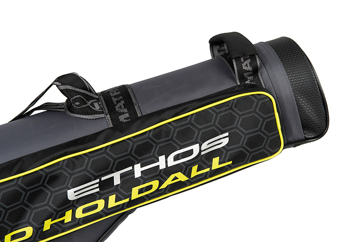 Matrix Ethos 2 Rod Holdall – detail van de Ethos-opdruk, gele rand, geweven draagriemen en verstevigde onderzijde